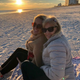 Hope and her mom on the beach at sunset